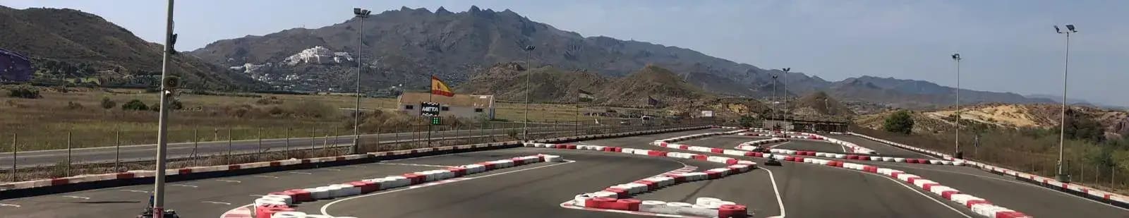 From the viewing platform at Karting Garrucha near Mojacar - a place for Go Carting. Looking at the track with some hills in the distance.